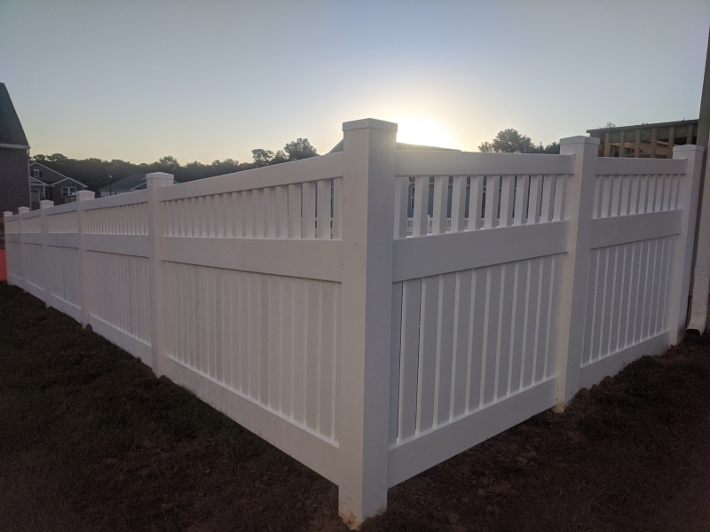 White vinyl picket fence